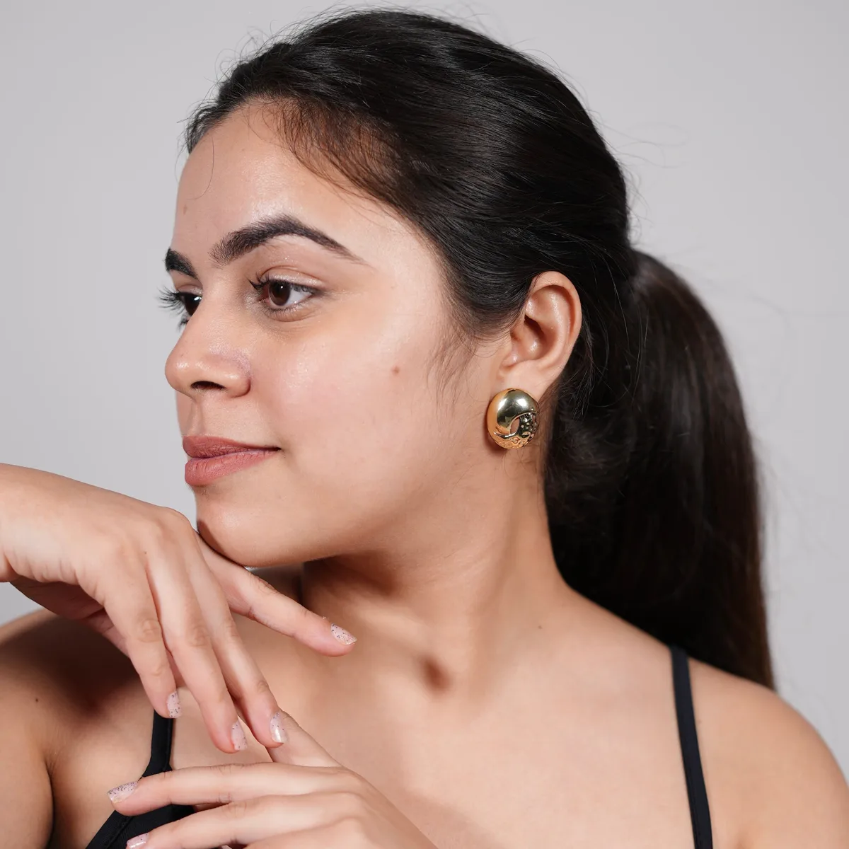 Bhavya wearing Crater Dome Metal Stud Earrings – Chunky Silver & Gold Statement Hoops